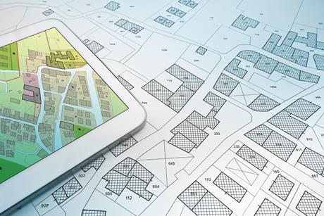Street plans with tablet shutterstock_2266106503 Francesco Scatena