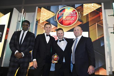 Torsion’s Dan Spencer and colleague accept the trophy from JLL’s Huw Forrest