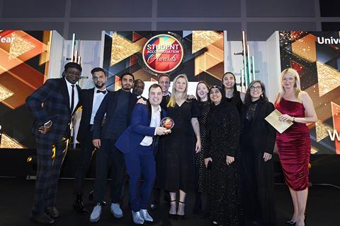 Collegiate’s Michelle Gardner gives the University Team of the Year award to the beaming LSE team